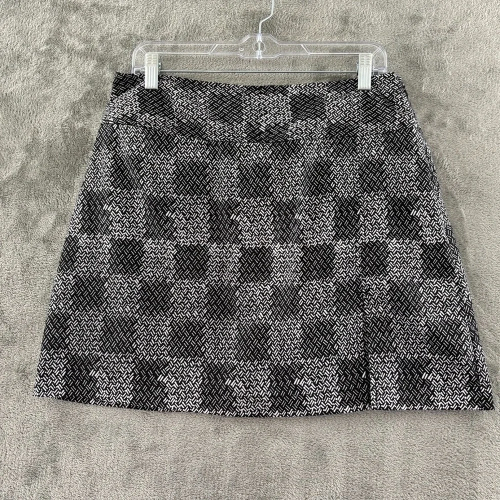 Izod XFG Golf Skort Womens 8 Black White Check Kick Pleat Pocket Stretch Zip‎
